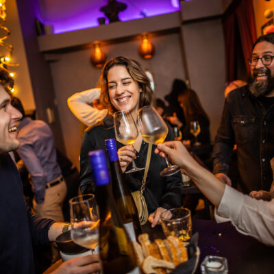 celebrating and toasting with wine at the bar